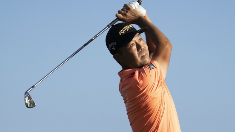 January 13, 2022; Honolulu, Hawaii, USA; Kevin Na hits his tee shot on the 17th hole during the first round of the Sony Open in Hawaii golf tournament at Waialae Country Club. Mandatory Credit: Kyle Terada-USA TODAY Sports