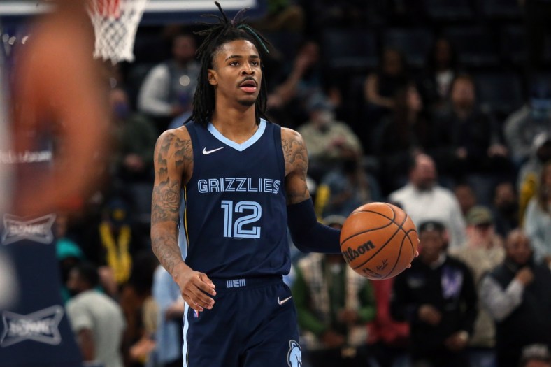 Jan 13, 2022; Memphis, Tennessee, USA; Memphis Grizzles guard Ja Morant (12) brings the ball up the court during the second half against the Minnesota Timberwolves at FedExForum. Mandatory Credit: Petre Thomas-USA TODAY Sports