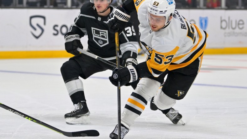 Jan 13, 2022; Los Angeles, California, USA; Pittsburgh Penguins center Teddy Blueger (53) takes a shot on goal in the first period of the game against the Los Angeles Kings at Crypto.com Arena. Mandatory Credit: Jayne Kamin-Oncea-USA TODAY Sports