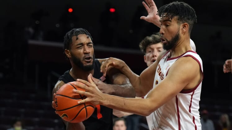 Jan 13, 2022; Los Angeles, California, USA; Oregon State Beavers forward Maurice Calloo (1) and Southern California Trojans forward Isaiah Mobley (3) battle for the ball in the first half at Galen Center. Mandatory Credit: Kirby Lee-USA TODAY Sports