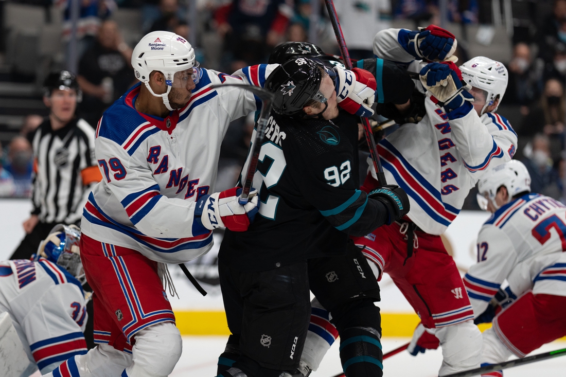 Jan 13, 2022; San Jose, California, USA;  New York Rangers defenseman K'Andre Miller (79) swings towards San Jose Sharks left wing Rudolfs Balcers (92) during the second period at SAP Center at San Jose. Mandatory Credit: Stan Szeto-USA TODAY Sports