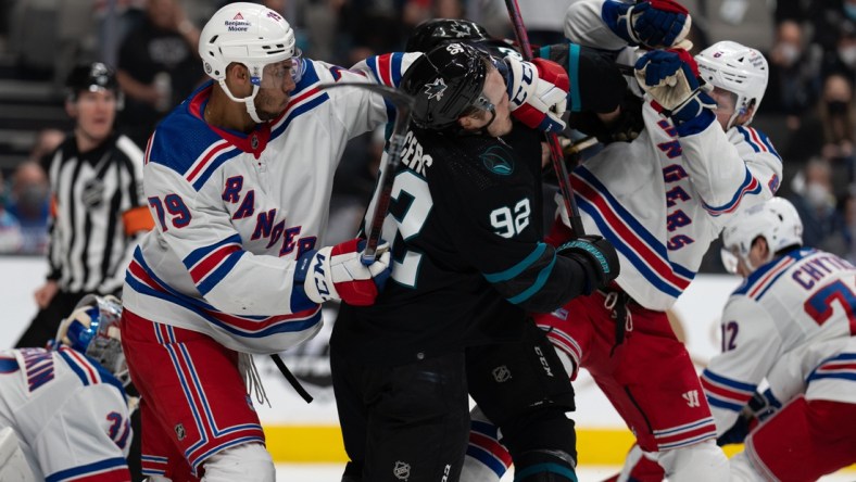 Jan 13, 2022; San Jose, California, USA;  New York Rangers defenseman K'Andre Miller (79) swings towards San Jose Sharks left wing Rudolfs Balcers (92) during the second period at SAP Center at San Jose. Mandatory Credit: Stan Szeto-USA TODAY Sports