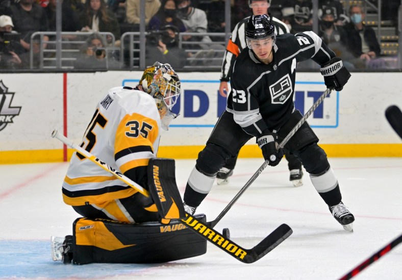 Jan 13, 2022; Los Angeles, California, USA; Los Angeles Kings right wing Dustin Brown (23) scores a goal past Pittsburgh Penguins goaltender Tristan Jarry (35) for his 700th career point in the second period of the game at Crypto.com Arena. Mandatory Credit: Jayne Kamin-Oncea-USA TODAY Sports