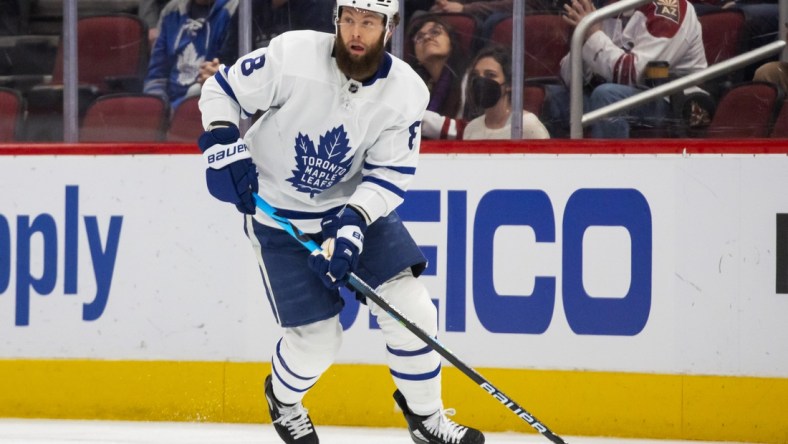 Jan 12, 2022; Glendale, Arizona, USA; Toronto Maple Leafs defenseman Jake Muzzin (8) against the Arizona Coyotes at Gila River Arena. Mandatory Credit: Mark J. Rebilas-USA TODAY Sports