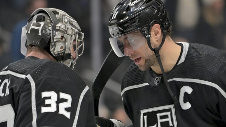Jan 13, 2022; Los Angeles, California, USA; Los Angeles Kings goaltender Jonathan Quick (32) and center Anze Kopitar (11) congratulate each other after the game against the Pittsburgh Penguins at Crypto.com Arena. Mandatory Credit: Jayne Kamin-Oncea-USA TODAY Sports