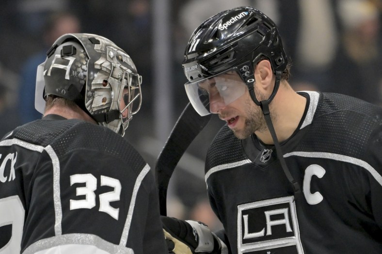Jan 13, 2022; Los Angeles, California, USA; Los Angeles Kings goaltender Jonathan Quick (32) and center Anze Kopitar (11) congratulate each other after the game against the Pittsburgh Penguins at Crypto.com Arena. Mandatory Credit: Jayne Kamin-Oncea-USA TODAY Sports