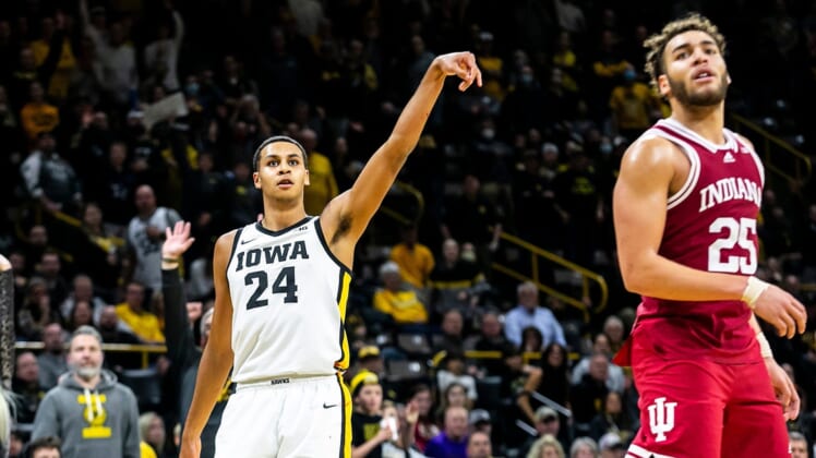 Iowa forward Kris Murray (24) watches after making a 3-point basket while Indiana forward Race Thompson, right, defends during a NCAA Big Ten Conference men's basketball game, Thursday, Jan. 13, 2022, at Carver-Hawkeye Arena in Iowa City, Iowa.Syndication Hawkcentral