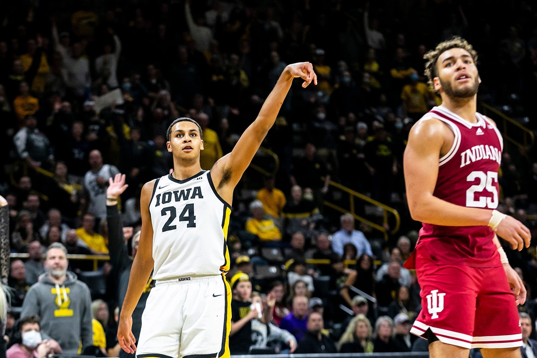 Iowa forward Kris Murray (24) watches after making a 3-point basket while Indiana forward Race Thompson, right, defends during a NCAA Big Ten Conference men's basketball game, Thursday, Jan. 13, 2022, at Carver-Hawkeye Arena in Iowa City, Iowa.

Syndication Hawkcentral