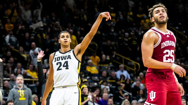 Iowa forward Kris Murray (24) watches after making a 3-point basket while Indiana forward Race Thompson, right, defends during a NCAA Big Ten Conference men's basketball game, Thursday, Jan. 13, 2022, at Carver-Hawkeye Arena in Iowa City, Iowa.

Syndication Hawkcentral