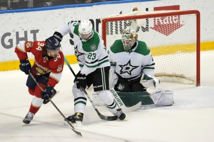 Jan 14, 2022; Sunrise, Florida, USA; Florida Panthers left wing Ryan Lomberg (94) attempts to redirect the puck in front of Dallas Stars defenseman Esa Lindell (23) and goaltender Jake Oettinger (29) during the first period at FLA Live Arena. Mandatory Credit: Jasen Vinlove-USA TODAY Sports