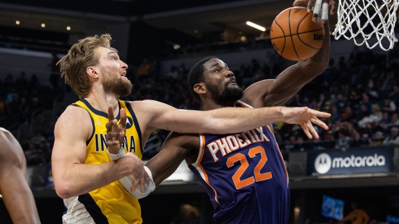 Jan 14, 2022; Indianapolis, Indiana, USA; Phoenix Suns center Deandre Ayton (22) rebounds the ball over Indiana Pacers forward Domantas Sabonis (11) in the second half at Gainbridge Fieldhouse. Mandatory Credit: Trevor Ruszkowski-USA TODAY Sports