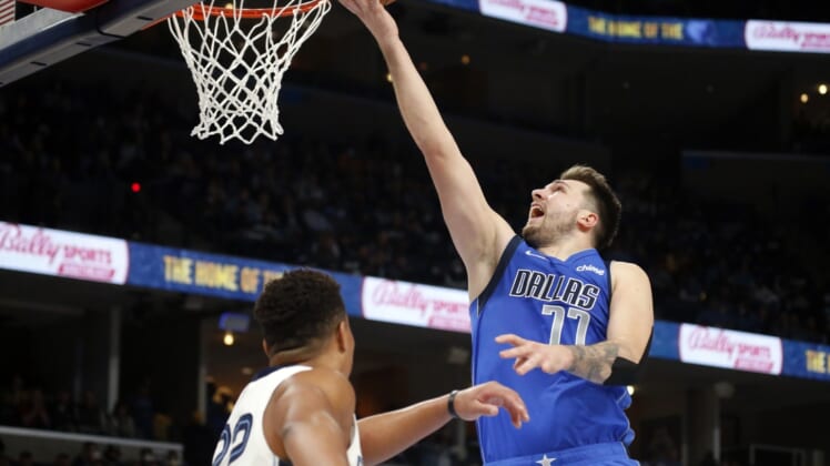 Jan 14, 2022; Memphis, Tennessee, USA; Dallas Mavericks guard Luka Doncic (77) shoots during the second half against the Memphis Grizzles at FedExForum. Mandatory Credit: Petre Thomas-USA TODAY Sports