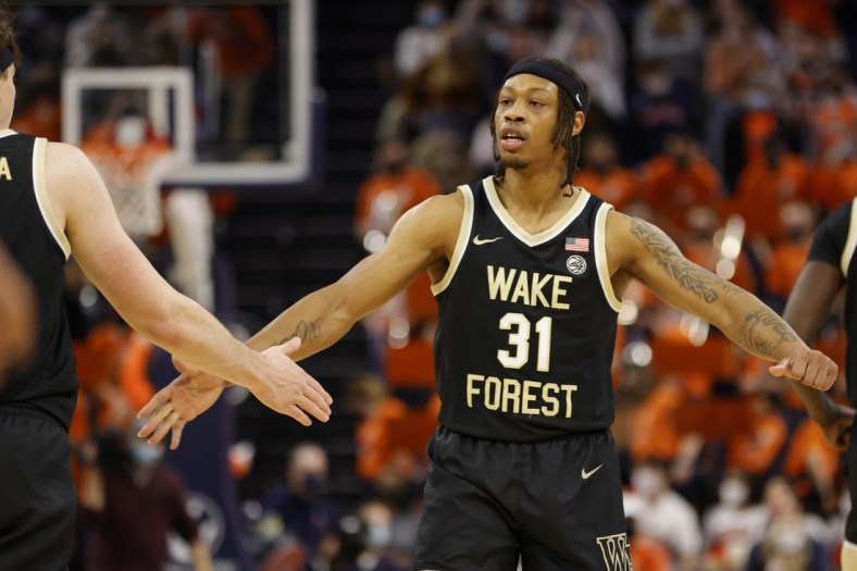 Jan 15, 2022; Charlottesville, Virginia, USA; Wake Forest Demon Deacons guard Alondes Williams (31) celebrates with Demon Deacons forward Jake LaRavia (0) against the Virginia Cavaliers during the second half at John Paul Jones Arena. Mandatory Credit: Geoff Burke-USA TODAY Sports