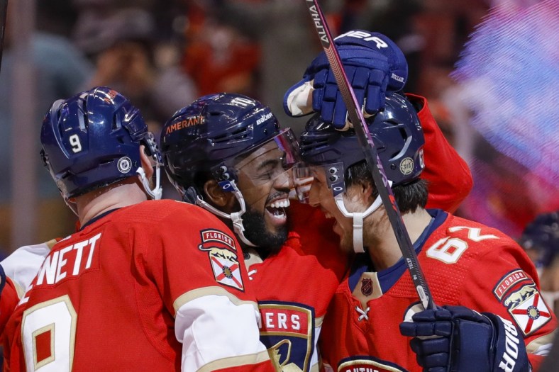 Jan 15, 2022; Sunrise, Florida, USA; Florida Panthers left wing Anthony Duclair (10) celebrates with center Sam Bennett (9) and defenseman Brandon Montour (62) after a goal by left wing Jonathan Huberdeau (not pictured) during the second period against the Columbus Blue Jackets at FLA Live Arena. Mandatory Credit: Sam Navarro-USA TODAY Sports