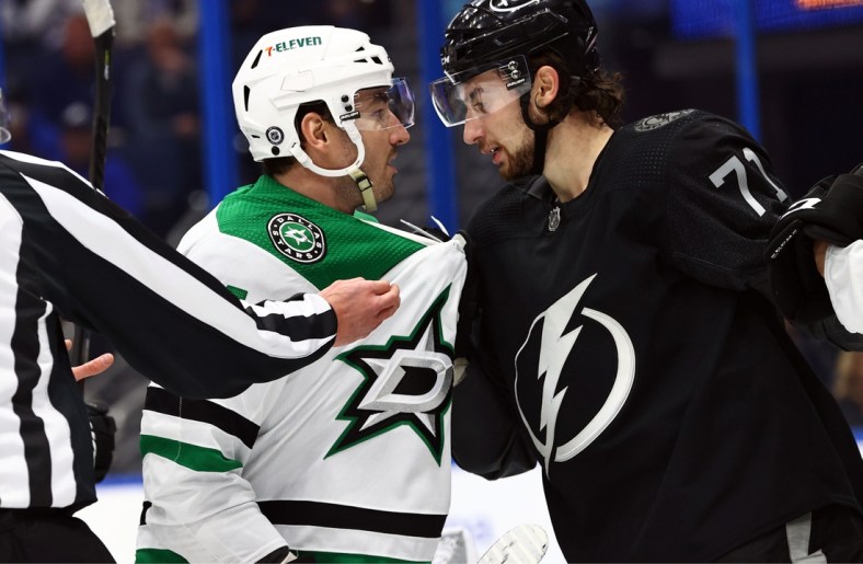 Jan 15, 2022; Tampa, Florida, USA; Dallas Stars defenseman Joel Hanley (44) and Tampa Bay Lightning left wing Pierre-Edouard Bellemare (41) talk during the first period at Amalie Arena. Mandatory Credit: Kim Klement-USA TODAY Sports