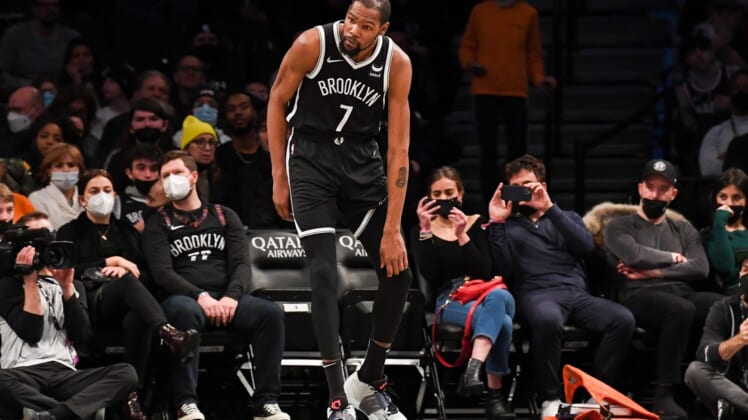 Jan 15, 2022; Brooklyn, New York, USA; Brooklyn Nets forward Kevin Durant (7) holds his knee after a collision against the New Orleans Pelicans during the second quarter at Barclays Center. Mandatory Credit: Dennis Schneidler-USA TODAY Sports