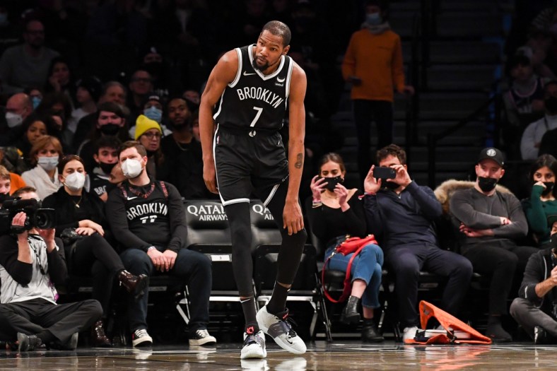 Jan 15, 2022; Brooklyn, New York, USA; Brooklyn Nets forward Kevin Durant (7) holds his knee after a collision against the New Orleans Pelicans during the second quarter at Barclays Center. Mandatory Credit: Dennis Schneidler-USA TODAY Sports