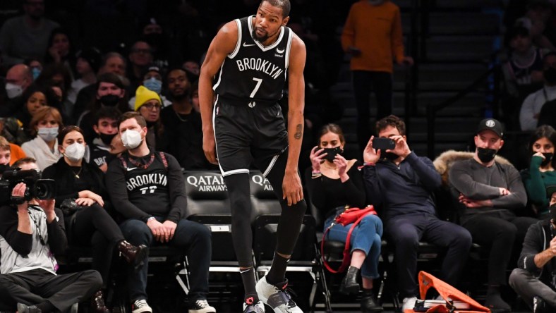 Jan 15, 2022; Brooklyn, New York, USA; Brooklyn Nets forward Kevin Durant (7) holds his knee after a collision against the New Orleans Pelicans during the second quarter at Barclays Center. Mandatory Credit: Dennis Schneidler-USA TODAY Sports