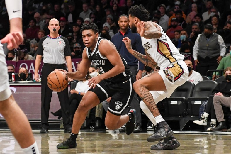 Jan 15, 2022; Brooklyn, New York, USA; Brooklyn Nets guard Cam Thomas (24) drives to the basket on  New Orleans Pelicans guard Nickeil Alexander-Walker (6) during the second quarter at Barclays Center. Mandatory Credit: Dennis Schneidler-USA TODAY Sports