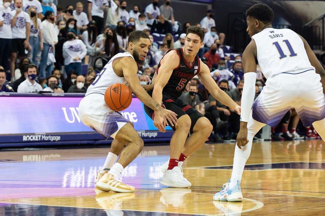 Jan 15, 2022; Seattle, Washington, USA; Washington Huskies guard Terrell Brown Jr. (23) steals the ball from Stanford Cardinal guard Michael O'Connell (5) during the first half at Alaska Airlines Arena at Hec Edmundson Pavilion. Washington defeated Stanford 67-64. Mandatory Credit: Steven Bisig-USA TODAY Sports