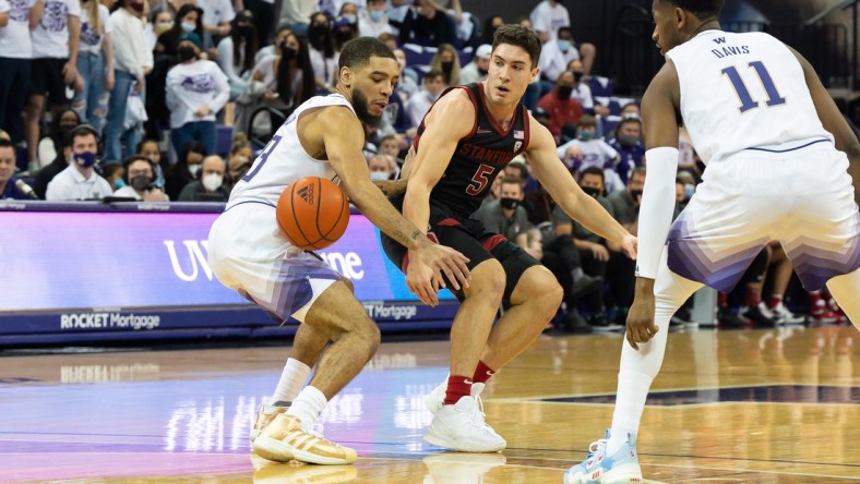 Jan 15, 2022; Seattle, Washington, USA; Washington Huskies guard Terrell Brown Jr. (23) steals the ball from Stanford Cardinal guard Michael O'Connell (5) during the first half at Alaska Airlines Arena at Hec Edmundson Pavilion. Washington defeated Stanford 67-64. Mandatory Credit: Steven Bisig-USA TODAY Sports