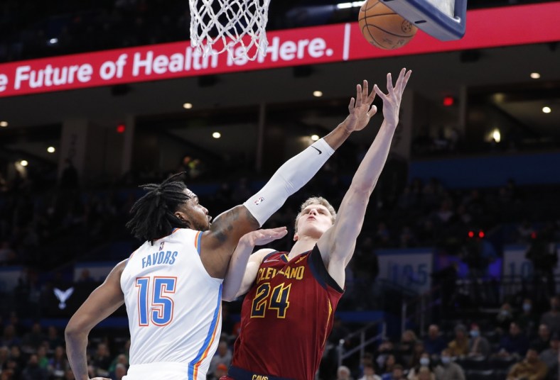 Jan 15, 2022; Oklahoma City, Oklahoma, USA; Cleveland Cavaliers forward Lauri Markkanen (24) goes up for a shot as Oklahoma City Thunder center Derrick Favors (15) defends the basket during the first quarter at Paycom Center. Mandatory Credit: Alonzo Adams-USA TODAY Sports