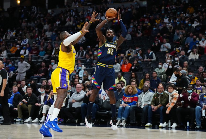 Jan 15, 2022; Denver, Colorado, USA; Denver Nuggets forward Jeff Green (32) shoots the ball over Los Angeles Lakers forward LeBron James (6) in the first quarter at Ball Arena. Mandatory Credit: Ron Chenoy-USA TODAY Sports