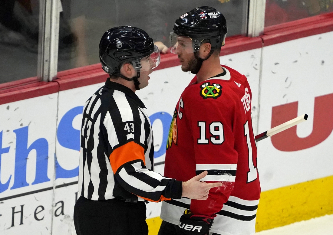 Jan 15, 2022; Chicago, Illinois, USA; Chicago Blackhawks center Jonathan Toews (19) talks with an official during the first period at United Center. Mandatory Credit: David Banks-USA TODAY Sports