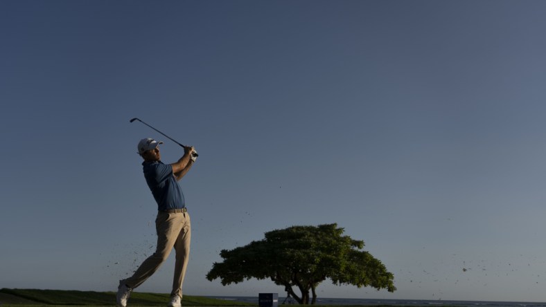 January 15, 2022; Honolulu, Hawaii, USA; Russell Henley hits his tee shot on the 17th hole during the third round of the Sony Open in Hawaii golf tournament at Waialae Country Club. Mandatory Credit: Kyle Terada-USA TODAY Sports