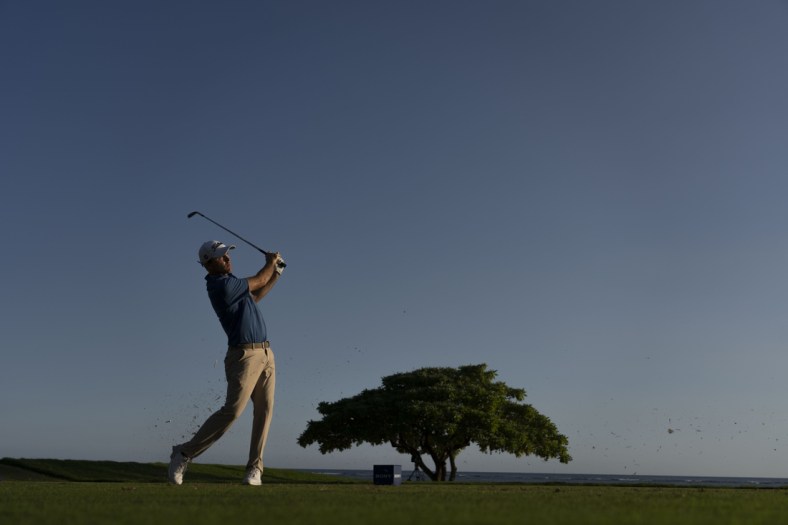 January 15, 2022; Honolulu, Hawaii, USA; Russell Henley hits his tee shot on the 17th hole during the third round of the Sony Open in Hawaii golf tournament at Waialae Country Club. Mandatory Credit: Kyle Terada-USA TODAY Sports