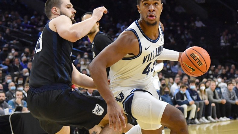 Jan 16, 2022; Philadelphia, Pennsylvania, USA; Villanova Wildcats forward Eric Dixon (43) drives to the basket against Butler Bulldogs forward Bryce Golden (33) during the first half at Wells Fargo Center. Mandatory Credit: Eric Hartline-USA TODAY Sports