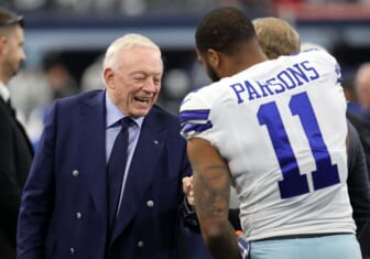 Jan 16, 2022; Arlington, Texas, USA; Dallas Cowboys owner Jerry Jones meets with outside linebacker Micah Parsons (11) prior to the NFC Wild Card playoff football game against the San Francisco 49ers at AT&T Stadium. Mandatory Credit: Kevin Jairaj-USA TODAY Sports