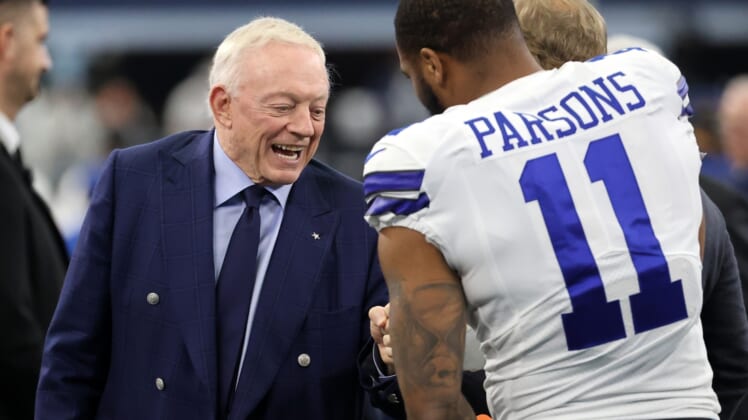 Jan 16, 2022; Arlington, Texas, USA; Dallas Cowboys owner Jerry Jones meets with outside linebacker Micah Parsons (11) prior to the NFC Wild Card playoff football game against the San Francisco 49ers at AT&T Stadium. Mandatory Credit: Kevin Jairaj-USA TODAY Sports