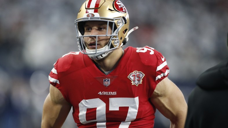 Jan 16, 2022; Arlington, Texas, USA; San Francisco 49ers defensive end Nick Bosa (97) on the field before the game against the Dallas Cowboys in a NFC Wild Card playoff football game at AT&T Stadium. Mandatory Credit: Tim Heitman-USA TODAY Sports