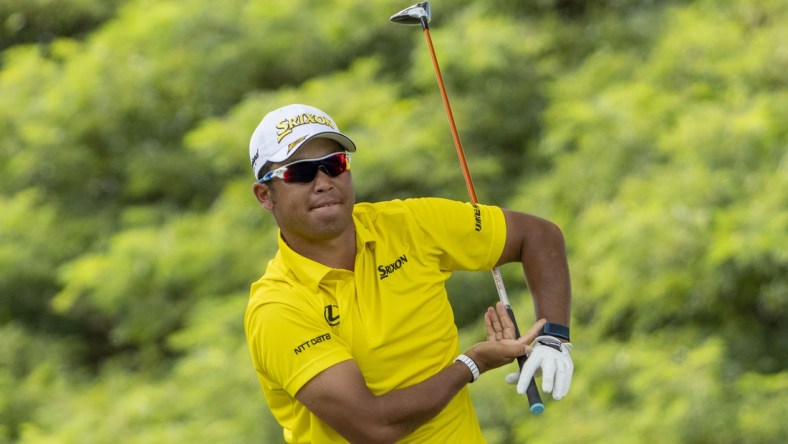 January 16, 2022; Honolulu, Hawaii, USA; Hideki Matsuyama reacts after hitting his tee shot on the second hole during the final round of the Sony Open in Hawaii golf tournament at Waialae Country Club. Mandatory Credit: Kyle Terada-USA TODAY Sports