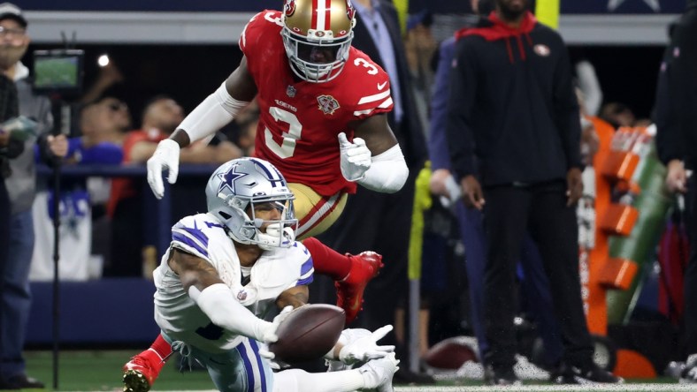 Jan 16, 2022; Arlington, Texas, USA; Dallas Cowboys wide receiver Ced Wilson (1) attempts but is unable to make a catch in front of San Francisco 49ers safety Jaquiski Tartt (3) during the second half of the NFC Wild Card playoff football game at AT&T Stadium. Mandatory Credit: Kevin Jairaj-USA TODAY Sports