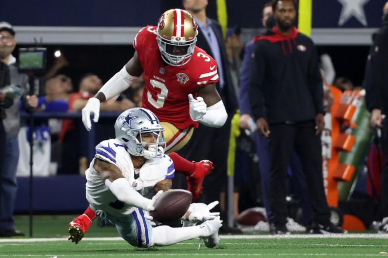 Jan 16, 2022; Arlington, Texas, USA; Dallas Cowboys wide receiver Ced Wilson (1) attempts but is unable to make a catch in front of San Francisco 49ers safety Jaquiski Tartt (3) during the second half of the NFC Wild Card playoff football game at AT&T Stadium. Mandatory Credit: Kevin Jairaj-USA TODAY Sports