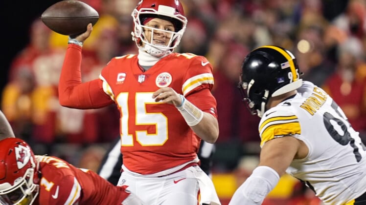 Jan 16, 2022; Kansas City, Missouri, USA; Kansas City Chiefs quarterback Patrick Mahomes (15) throws a pass ahead of Pittsburgh Steelers defensive end Chris Wormley (95) during the first quarter in an AFC Wild Card playoff football game at GEHA Field at Arrowhead Stadium. Mandatory Credit: Jay Biggerstaff-USA TODAY Sports