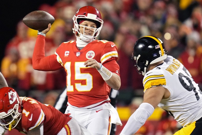 Jan 16, 2022; Kansas City, Missouri, USA; Kansas City Chiefs quarterback Patrick Mahomes (15) throws a pass ahead of Pittsburgh Steelers defensive end Chris Wormley (95) during the first quarter in an AFC Wild Card playoff football game at GEHA Field at Arrowhead Stadium. Mandatory Credit: Jay Biggerstaff-USA TODAY Sports