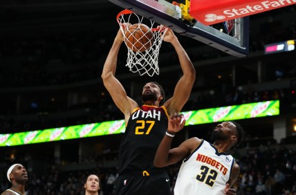Jan 16, 2022; Denver, Colorado, USA; Utah Jazz center Rudy Gobert (27) dunks the ball over Denver Nuggets forward Jeff Green (32) in the second quarter at Ball Arena. Mandatory Credit: Ron Chenoy-USA TODAY Sports