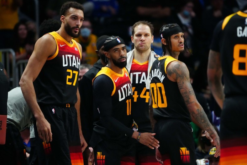 Jan 16, 2022; Denver, Colorado, USA; Utah Jazz center Rudy Gobert (27) and guard Mike Conley (11) and forward Bojan Bogdanovic (44) and guard Jordan Clarkson (00) during the fourth quarter against the Denver Nuggets  at Ball Arena. Mandatory Credit: Ron Chenoy-USA TODAY Sports