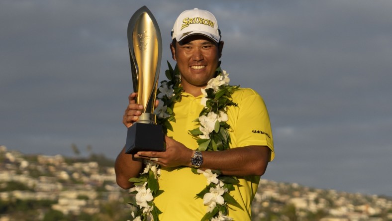 January 16, 2022; Honolulu, Hawaii, USA; Hideki Matsuyama poses with the trophy during the final round of the Sony Open in Hawaii golf tournament at Waialae Country Club. Mandatory Credit: Kyle Terada-USA TODAY Sports