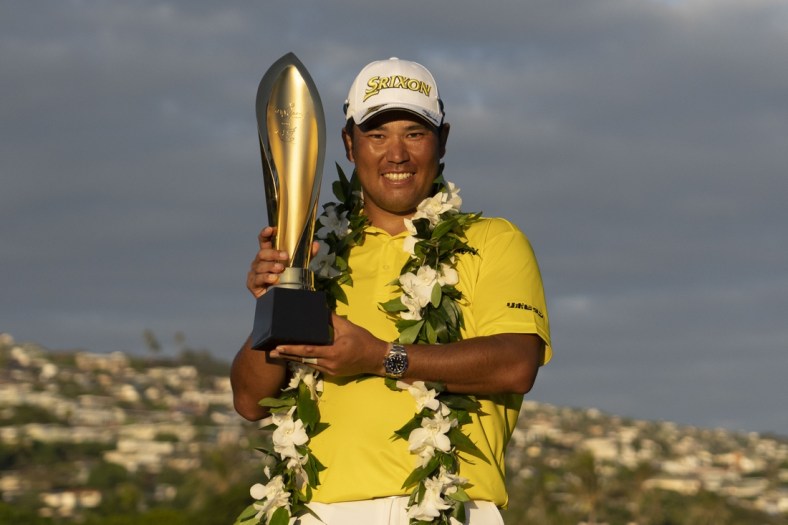 January 16, 2022; Honolulu, Hawaii, USA; Hideki Matsuyama poses with the trophy during the final round of the Sony Open in Hawaii golf tournament at Waialae Country Club. Mandatory Credit: Kyle Terada-USA TODAY Sports