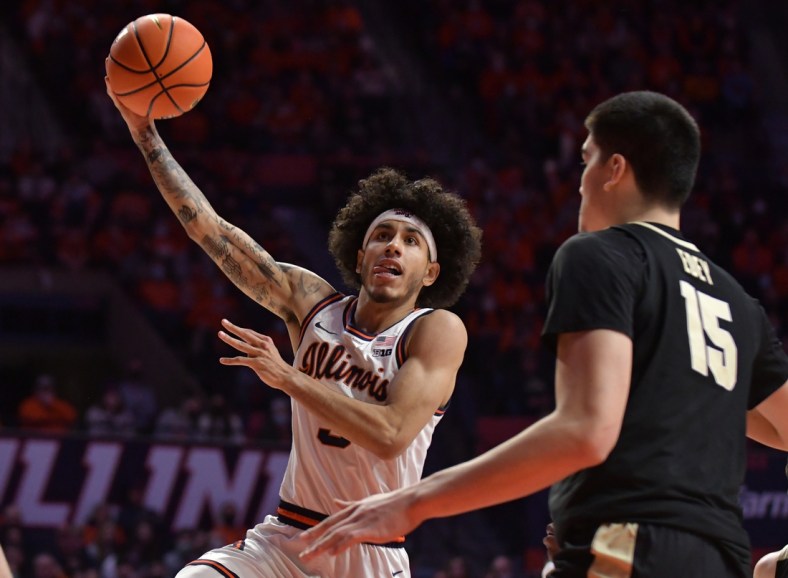 Jan 17, 2022; Champaign, Illinois, USA;  Illinois Fighting Illini guard Andre Curbelo (5) drives to the basket during the first half  against the Purdue Boilermakers at State Farm Center. Mandatory Credit: Ron Johnson-USA TODAY Sports