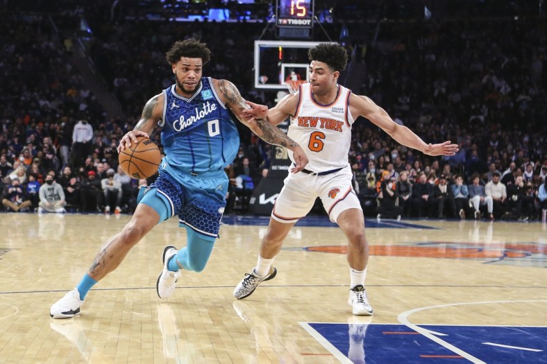 Jan 17, 2022; New York, New York, USA;  Charlotte Hornets forward Miles Bridges (0) drives past New York Knicks guard Quentin Grimes (6) in the second quarter at Madison Square Garden. Mandatory Credit: Wendell Cruz-USA TODAY Sports
