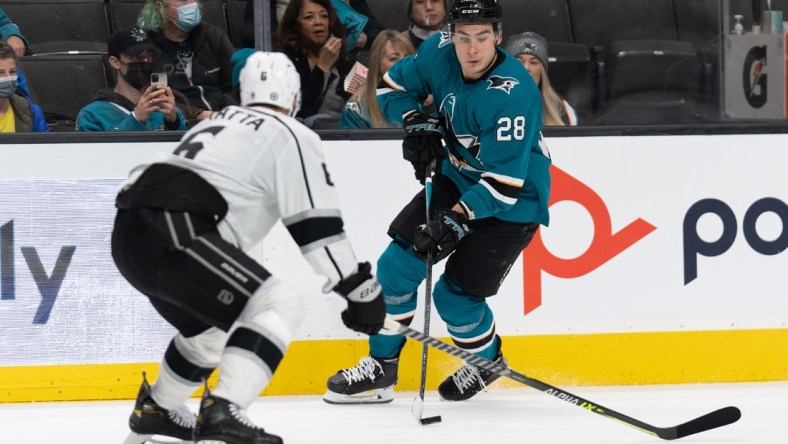 Jan 17, 2022; San Jose, California, USA; San Jose Sharks right wing Timo Meier (28) controls the puck during the second period against the Los Angeles Kings defenseman Olli Maatta (6) at SAP Center at San Jose. Mandatory Credit: Stan Szeto-USA TODAY Sports