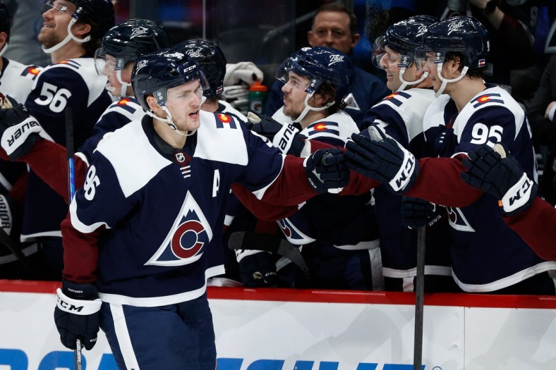 Jan 17, 2022; Denver, Colorado, USA; Colorado Avalanche right wing Mikko Rantanen (96) celebrates with the bench after his goal in the overtime shootout against the Minnesota Wild at Ball Arena. Mandatory Credit: Isaiah J. Downing-USA TODAY Sports