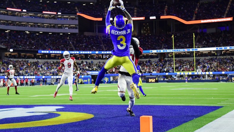 Jan 17, 2022; Inglewood, California, USA; Los Angeles Rams wide receiver Odell Beckham Jr. (3) catches a touchdown pass against Arizona Cardinals cornerback Marco Wilson (20) during the first half in the NFC Wild Card playoff football game at SoFi Stadium. Mandatory Credit: Gary A. Vasquez-USA TODAY Sports