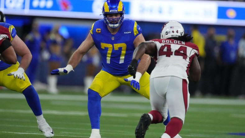 Jan 17, 2022; Inglewood, California, USA; Los Angeles Rams offensive tackle Andrew Whitworth (77) defends against Arizona Cardinals outside linebacker Markus Golden (44) during the second half of an NFC Wild Card playoff football game at SoFi Stadium. The Rams defeated the Cardinals 34-11. Mandatory Credit: Kirby Lee-USA TODAY Sports