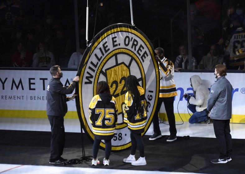 Jan 18, 2022; Boston, Massachusetts, USA;  Former Boston Bruins player Willie O Ree has his number retired and raised to the rafters prior to a game against the Carolina Hurricanes at TD Garden. Mandatory Credit: Bob DeChiara-USA TODAY Sports